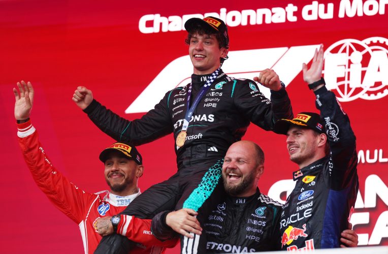 MONTREAL, QUEBEC - MAY 24: Race winner Andrea Kimi Antonelli of Italy and Mercedes AMG Petronas F1 Team, Second placed, Lewis Hamilton of Great Britain and Scuderia Ferrari Third placed Max Verstappen of the Netherlands and Oracle Red Bull Racing, and Dean Hale, Senior Race Team Composite Technician at Mercedes AMG Petronas F1 Team celebrate on the podium during the F1 Grand Prix of Canada at Circuit Gilles-Villeneuve on May 24, 2026 in Montreal, Quebec. (Photo by Alastair Staley/LAT Images)