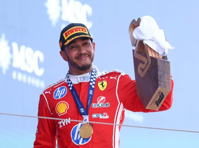 BARCELONA, SPAIN - JUNE 14: Race winner Lewis Hamilton of Great Britain and Scuderia Ferrari celebrates with his trophy on the podium during the F1 Grand Prix of Barcelona-Catalunya at Circuit de Barcelona-Catalunya on June 14, 2026 in Barcelona, Spain. (Photo by Clive Mason/Getty Images)