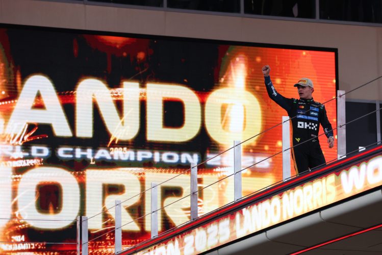 ABU DHABI, UNITED ARAB EMIRATES - DECEMBER 07: 2025 F1 World Drivers Champion and Third placed Lando Norris of Great Britain and McLaren celebrates on the podium during the F1 Grand Prix of Abu Dhabi at Yas Marina Circuit on December 07, 2025 in Abu Dhabi, United Arab Emirates. (Photo by Andy Hone/LAT Images)
