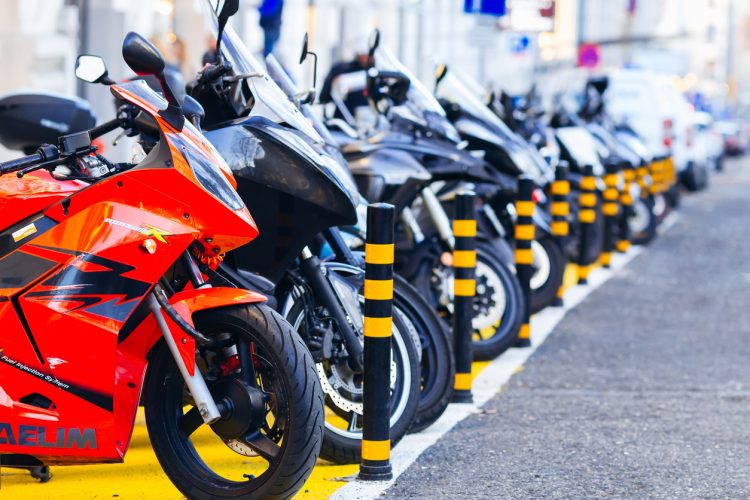 Lisbon, Portugal - Jan 26, 2018 a close-up of motorcycles that are parked in a row at a specially equipped parking lot